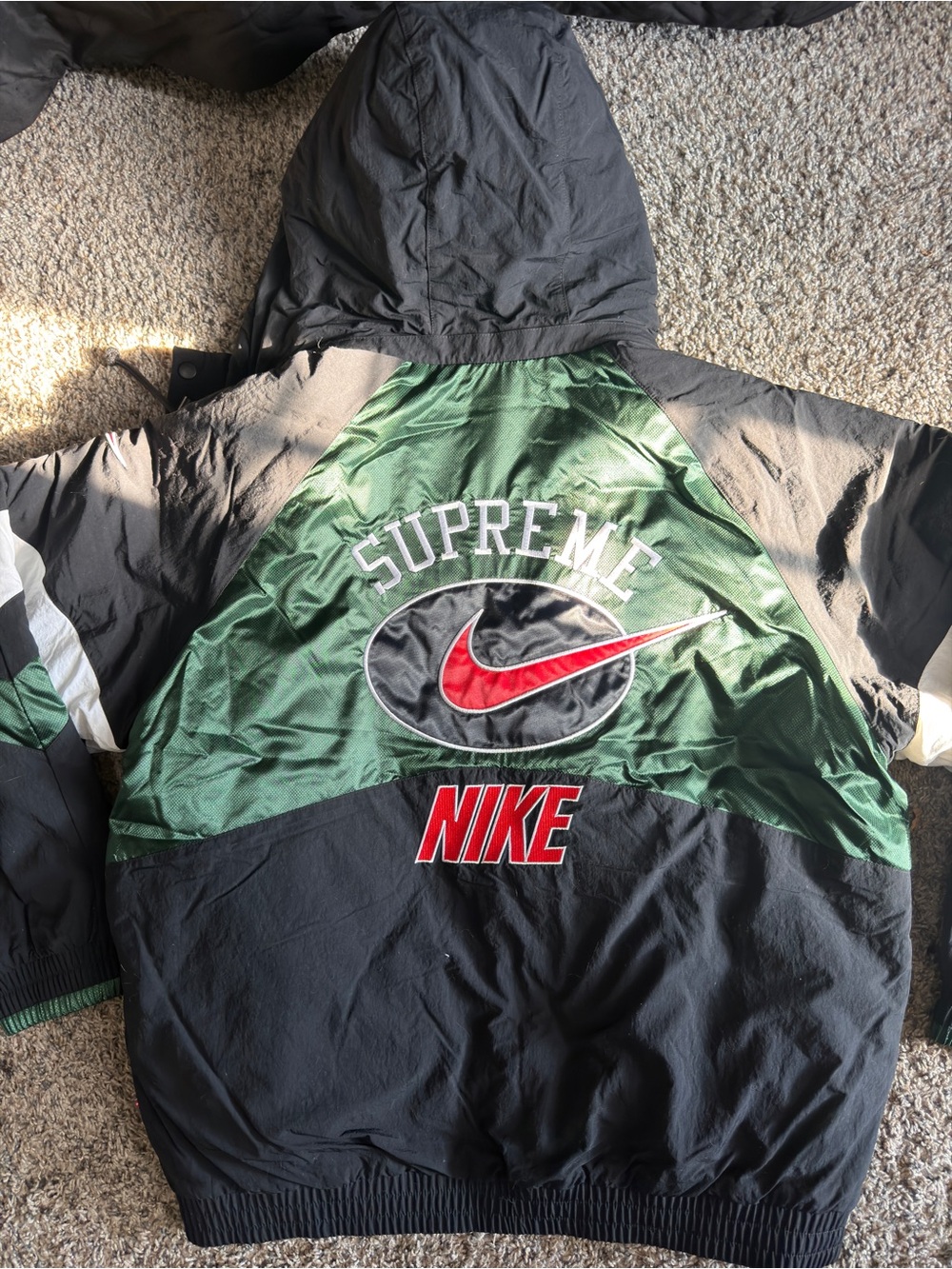 Nike x Supreme  Black and Green Hooded Windbreaker with Red Accents